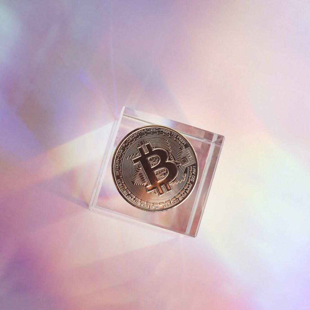 Golden bitcoin coin on holographic, abstract, neon background. digital currency, business style.