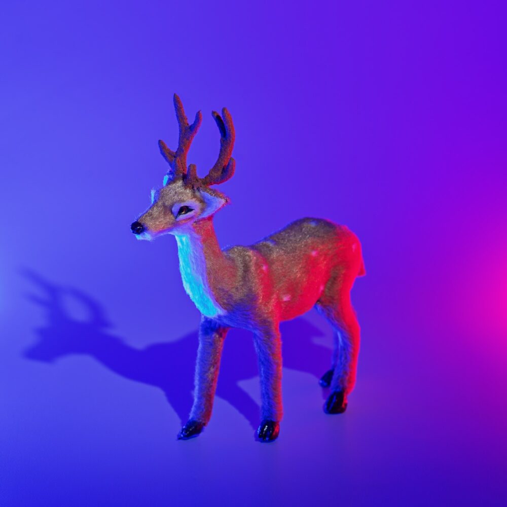 Modern conceptual art deer with shadow in duotone red and blue lights